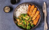 Fried tempeh with rice and broccoli.