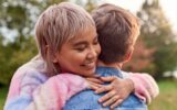 Loving Couple Outdoors In Countryside Laughing And Hugging