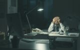 Stressed business executive working overtime