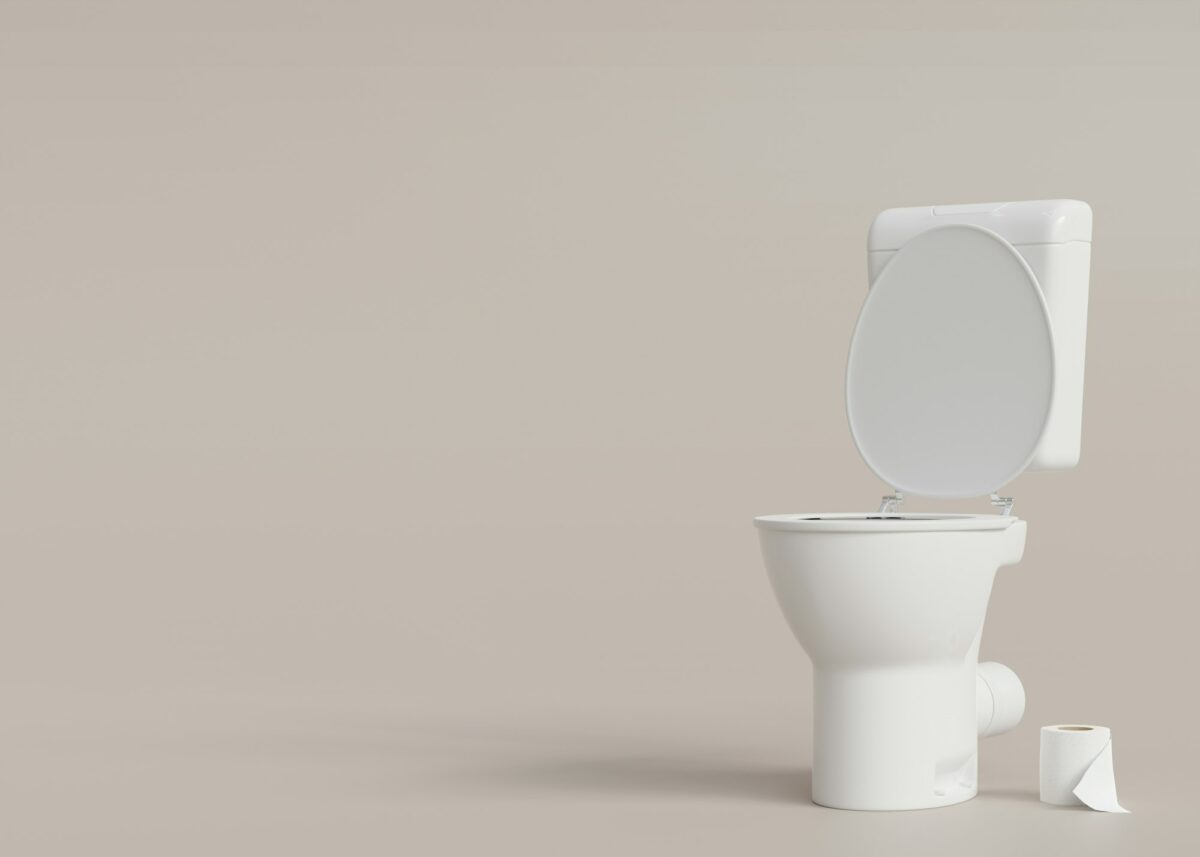 Toilet, WC on beige background with copy space. Hygiene, defecation, problems with digestion