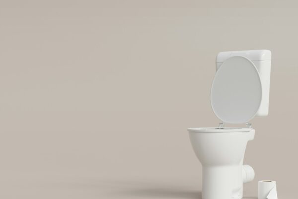 Toilet, WC on beige background with copy space. Hygiene, defecation, problems with digestion