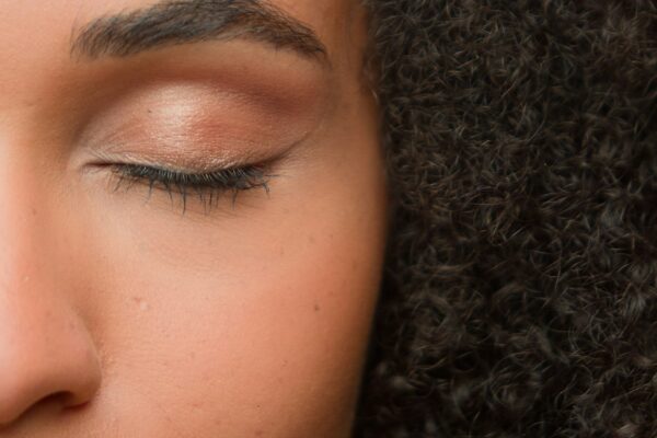 Beauty female portrait half of face close up eye beautiful make-up arrow eyelashes eyeliner eyelid