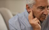 Senior man with hearing problems
