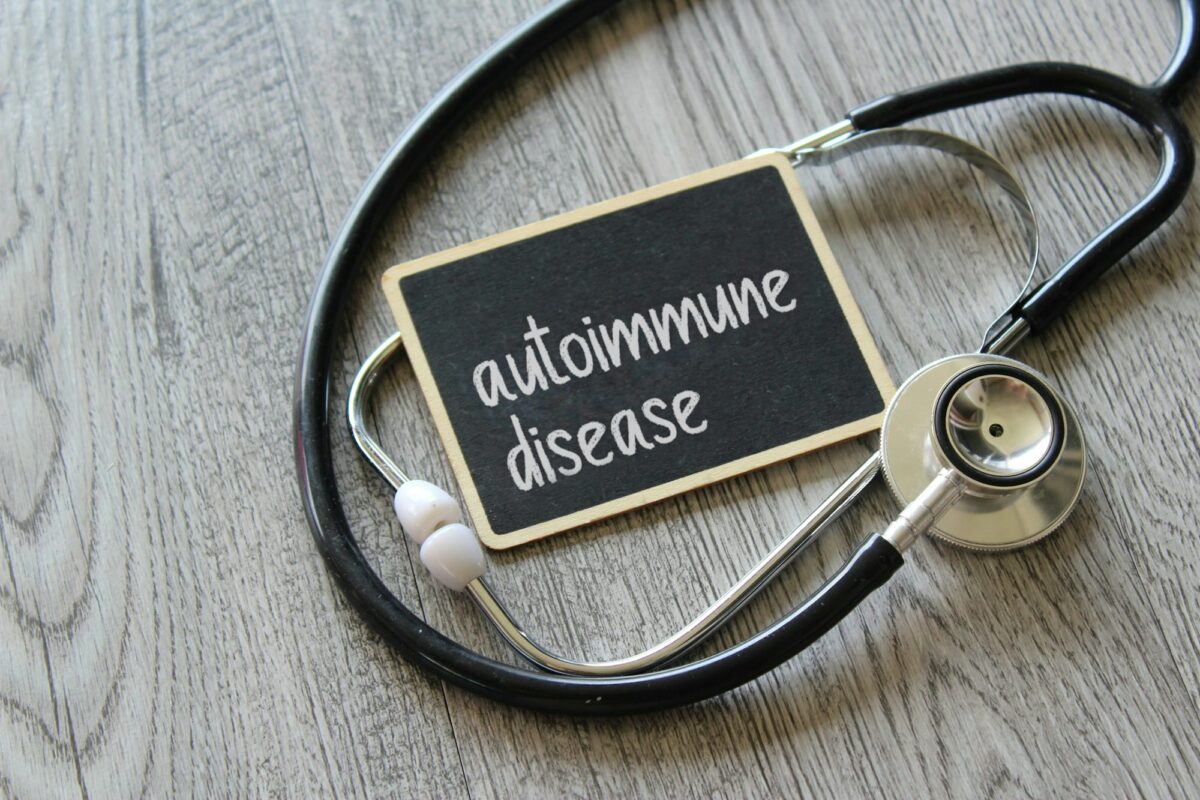 Stethoscope and chalkboard with text AUTOIMMUNE DISEASE