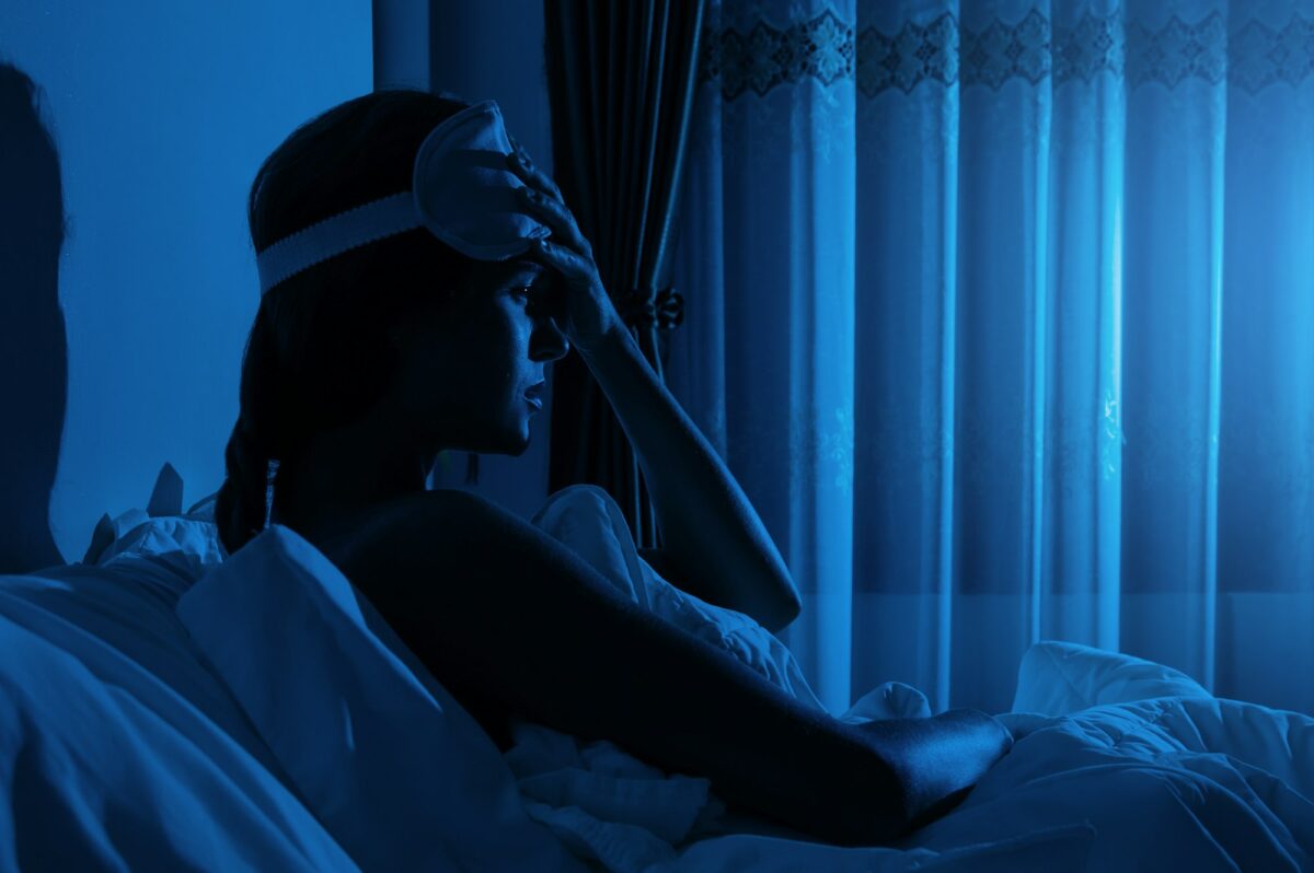 Young woman with a headache and insomnia