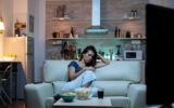 Lady asleep on sofa alone in living room