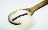 sugar in a puff with the word cholesterol.