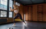 Woman training with fitness rubber band