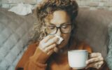 Sick woman at home blowing nose and take care of influenza virus disease. One female people