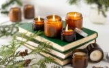 A set of different aroma candles in glass jars on a white background. Scented handmade candle. Soy