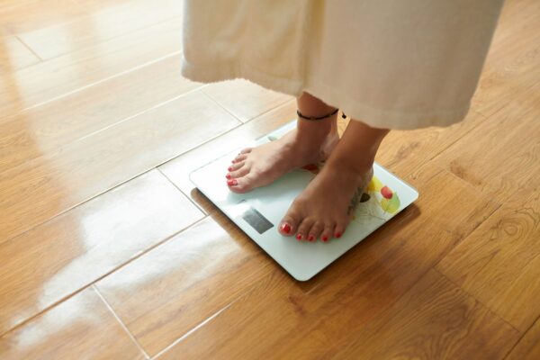 Checking body weight on digital scale