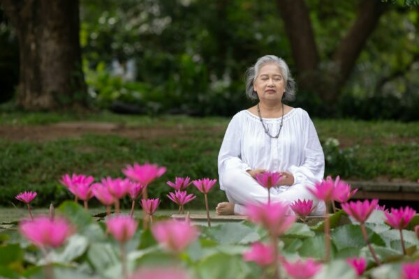 Elderly Woman Practicing Yoga and Meditation