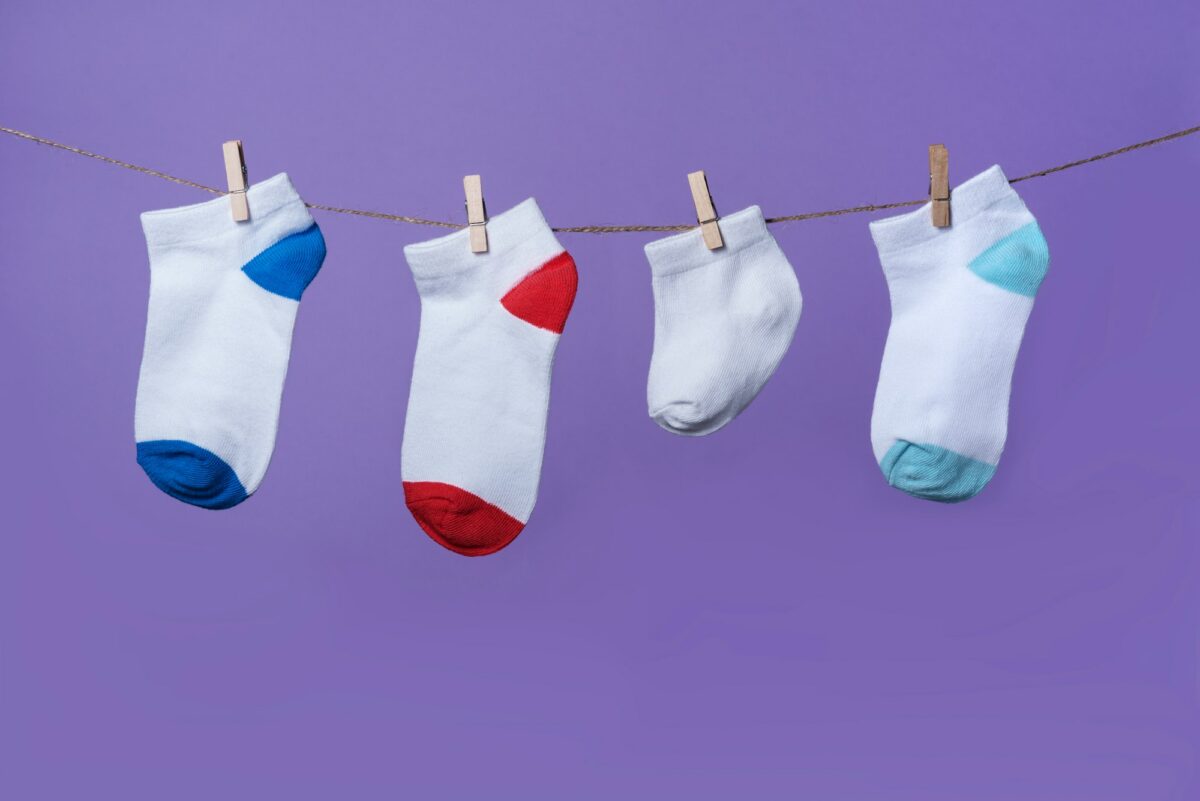 Premature baby day concept. Tiny socks