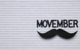 The inscription "Movember" in black letters on a light background