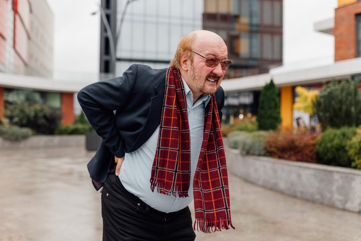 Urban Back Pain Alert Worried Senior aged Rheumatism Distress in the City