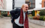 Urban Back Pain Alert Worried Senior aged Rheumatism Distress in the City