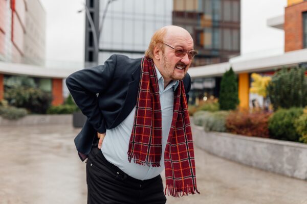 Urban Back Pain Alert Worried Senior aged Rheumatism Distress in the City