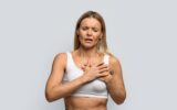 Middle aged woman suffering from severe chest pain