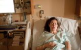 Pregnant woman in labor on hospital bed
