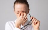 Vision problem. adult woman massaging tired eyes, poor vision concept, ophthalmology